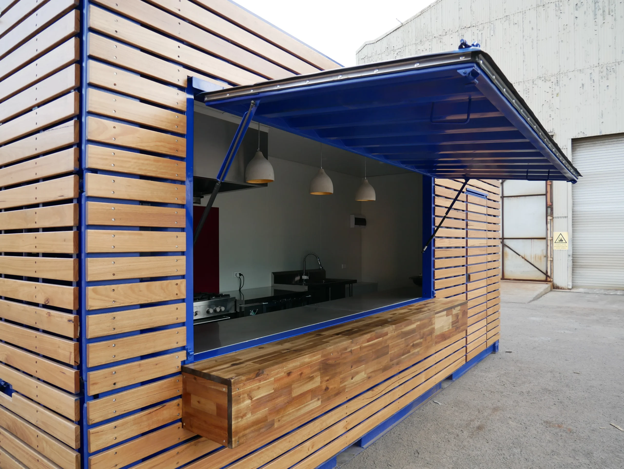 Desain Cafe Outdoor Instagramable pada Container Cafe with Timber Facade 3