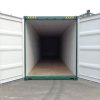 40' high cube shipping container warna hijau, pintu belakang terbuka.